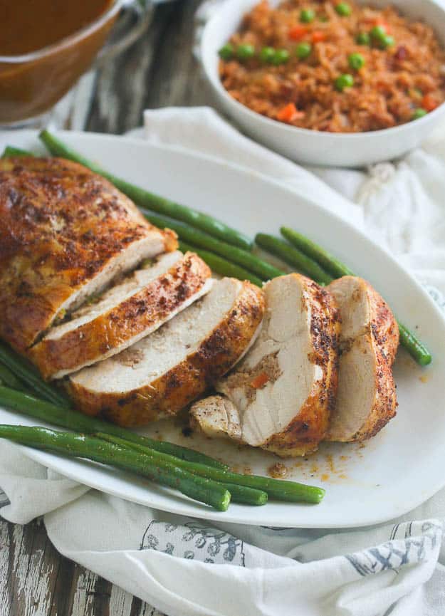 Ashanti Deboned Chicken Served with Green Beans and Jollof Rice