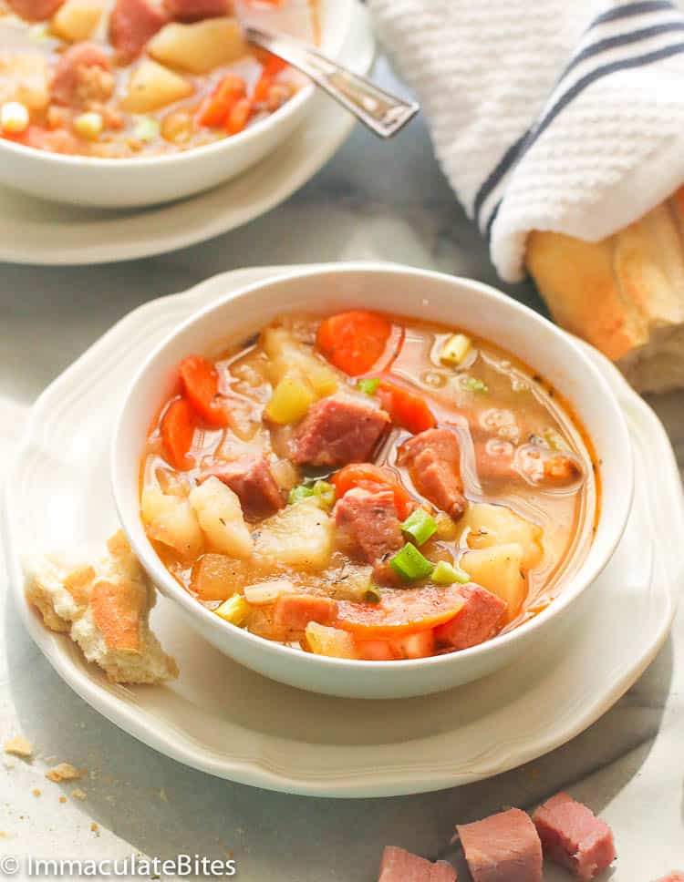 Two Bowls of Protein-rich ham and bean soup served with bread
