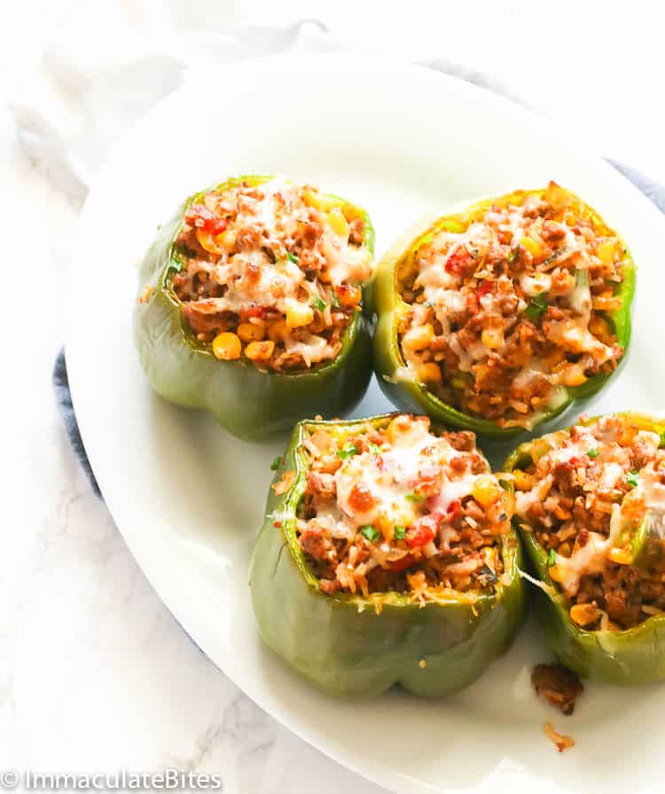 Ground chicken stuffed bell peppers topped with cheese