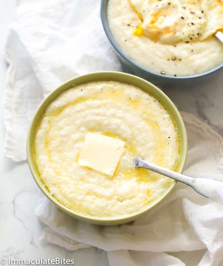 A Bowl of Grits with Butter and Another Bowl of Grits Topped with Fried Egg