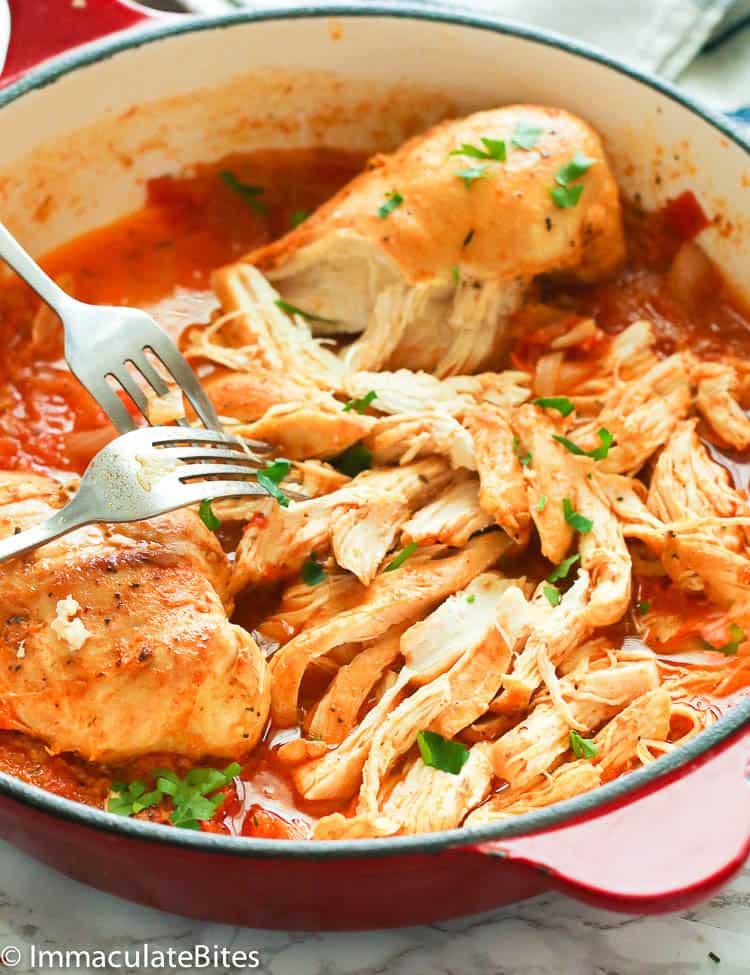 A Skillet of Shredded Chicken Using Two Forks