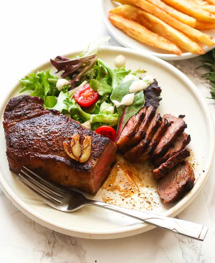 Pan-seared oven roasted steak carving