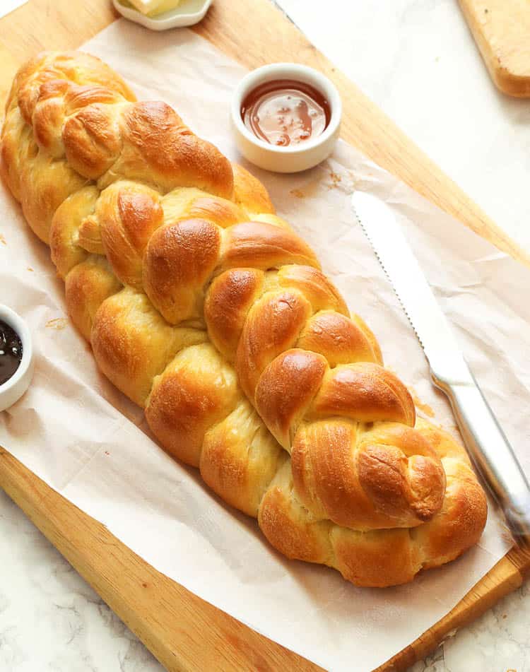 Challah bread beautifully presented with jam