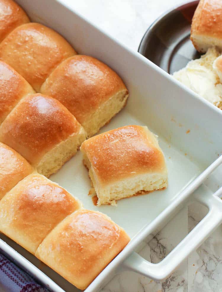 Easy Dinner Rolls with Three Rolls Gone in a Baking Dish