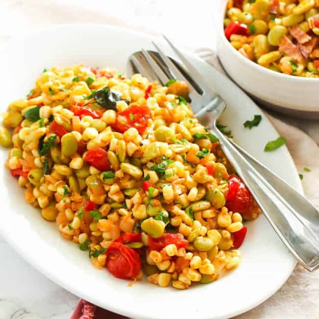 Insanely comforting Succotash on a white serving plate