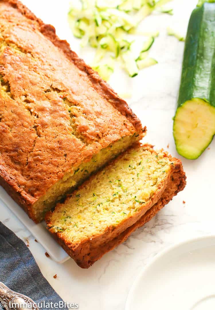 Zucchini Bread with Sliced Zucchini in the Background