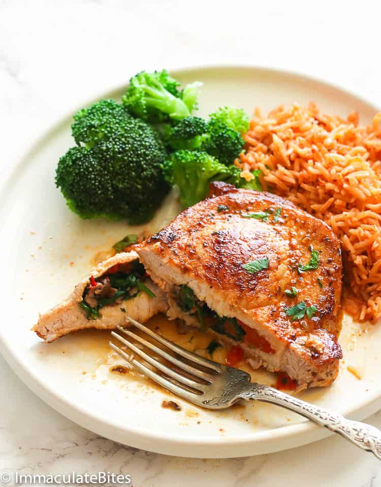 Half-eaten Stuffed Pork Chops Served with Broccoli and Mexican Rice