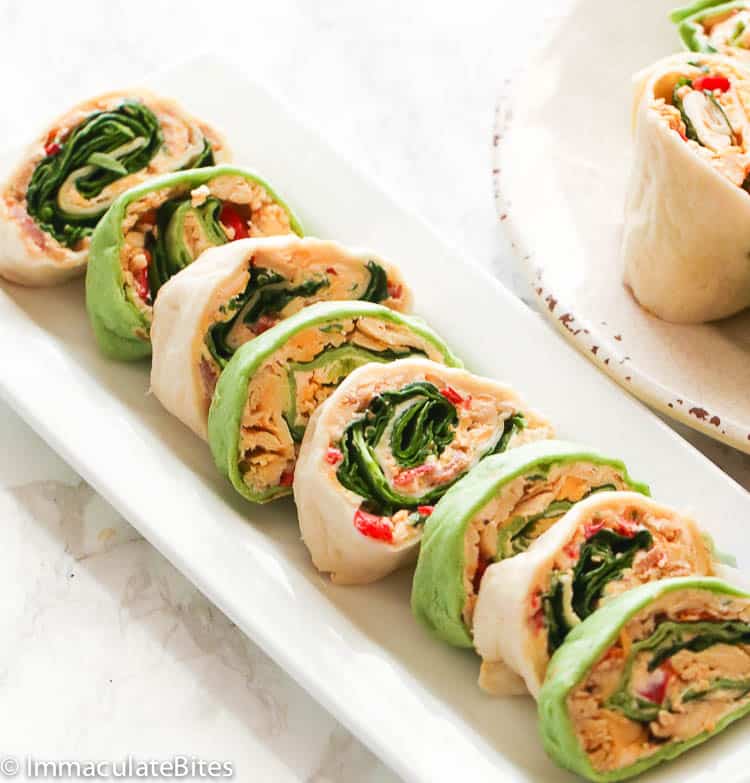 A platter lined with cute pinwheel sandwiches for game day.