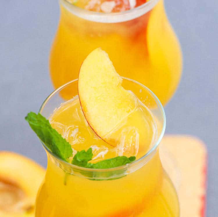 Peach Bellini Topped with Peach Slice and Mint