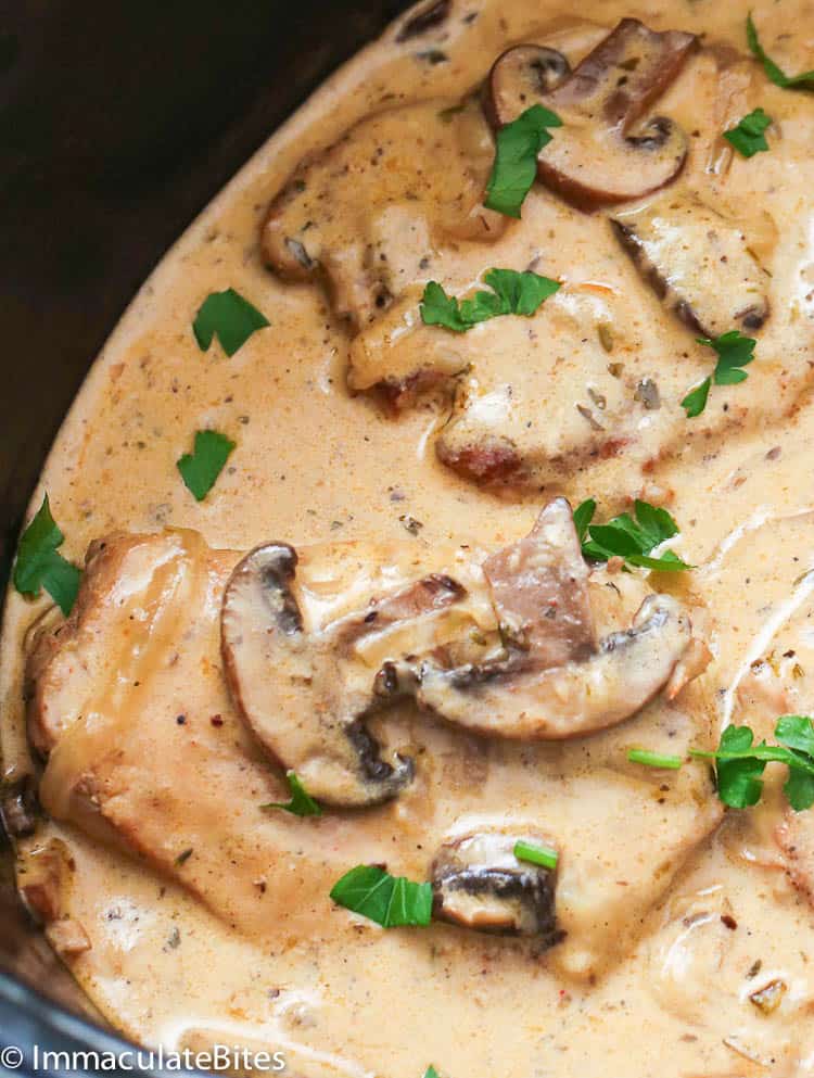 Crockpot pork chops simmered in mushroom gravy sauce