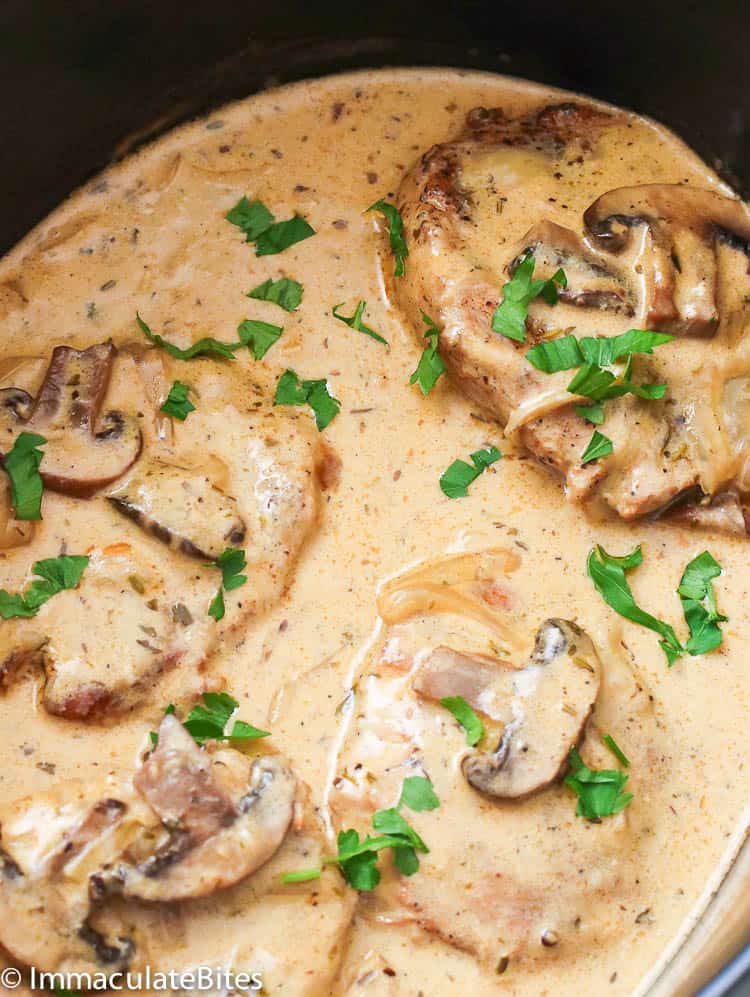 Slow cooker Pork Chop with Mushrooms Garnished with Parsley