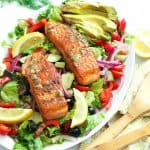 Salmon filets in a bed of colorful veggies
