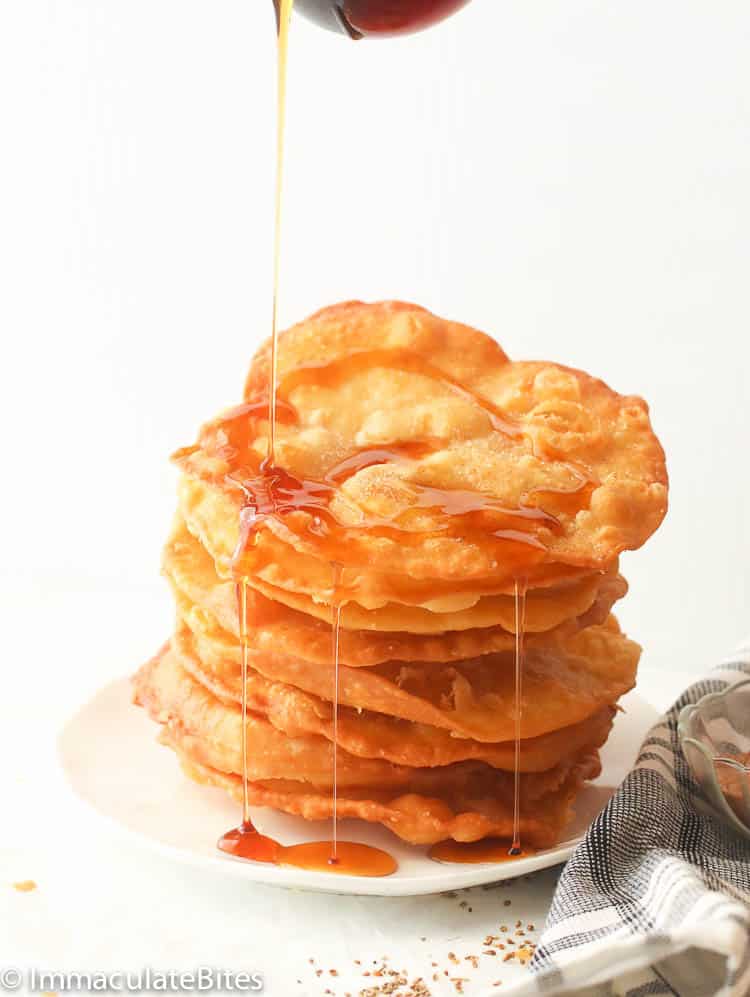 Bunuelos Recipe drizzled with Piloncillo Syrup