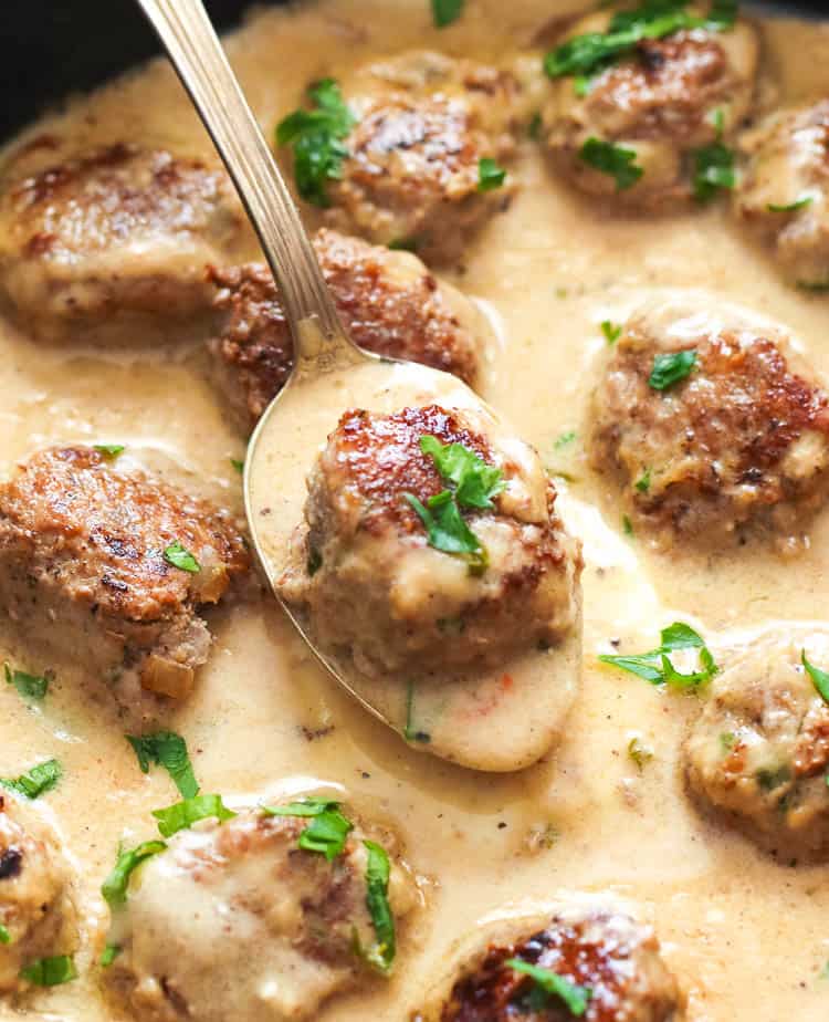 Swedish Meatballs in a creamy sauce and garnished with fresh parsley