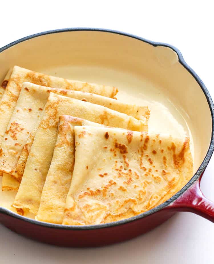 Crepes ready to be drizzled in orange butter sauce for an incredible crepes suzette