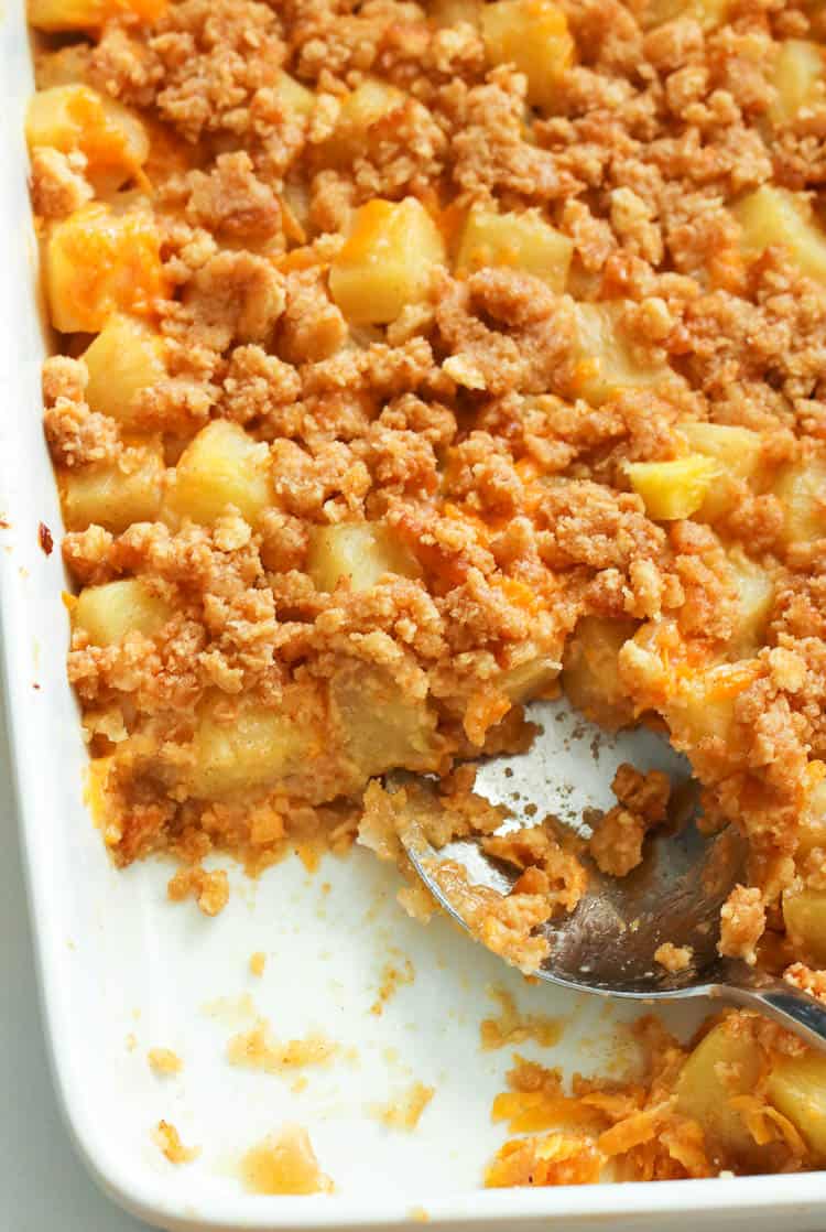 Upclose Shot of Pineapple Casserole with a Portion Gine