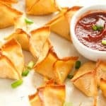 Crispy delicious Crab Rangoon with hot sauce