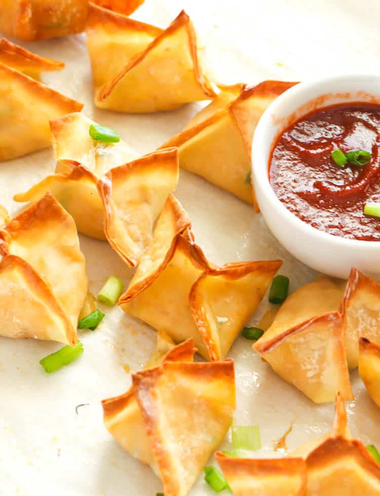 Crispy delicious Crab Rangoon with hot sauce