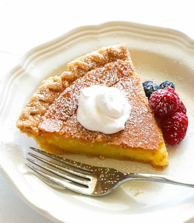 Enjoying a soul-satisfying slice of Buttermilk Chess Pie topped with homemade whipped cream