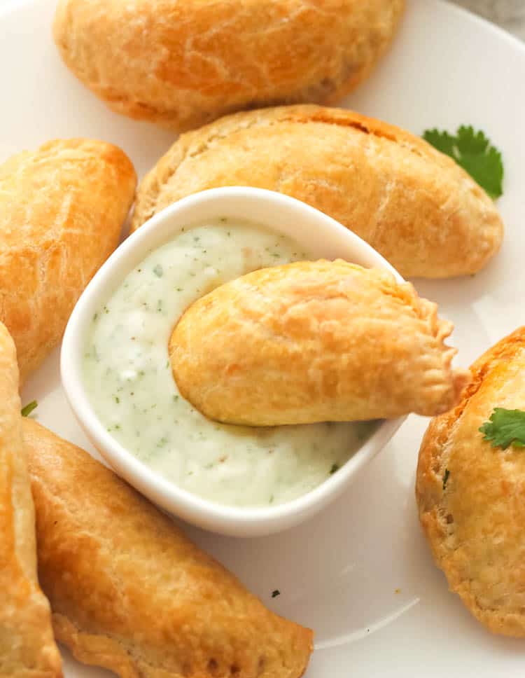 Beef Empanada Dipped in a Sauce