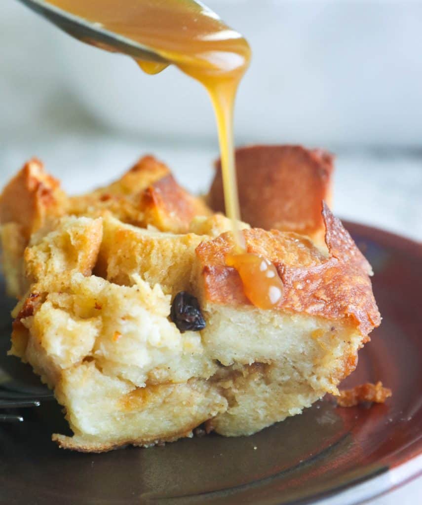 A Slice of Bread Pudding Poured Over with Rum Sauce