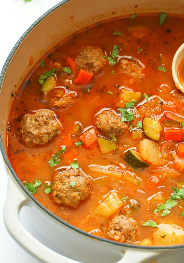 Meaty albondigas soup in a white Dutch Oven Pot