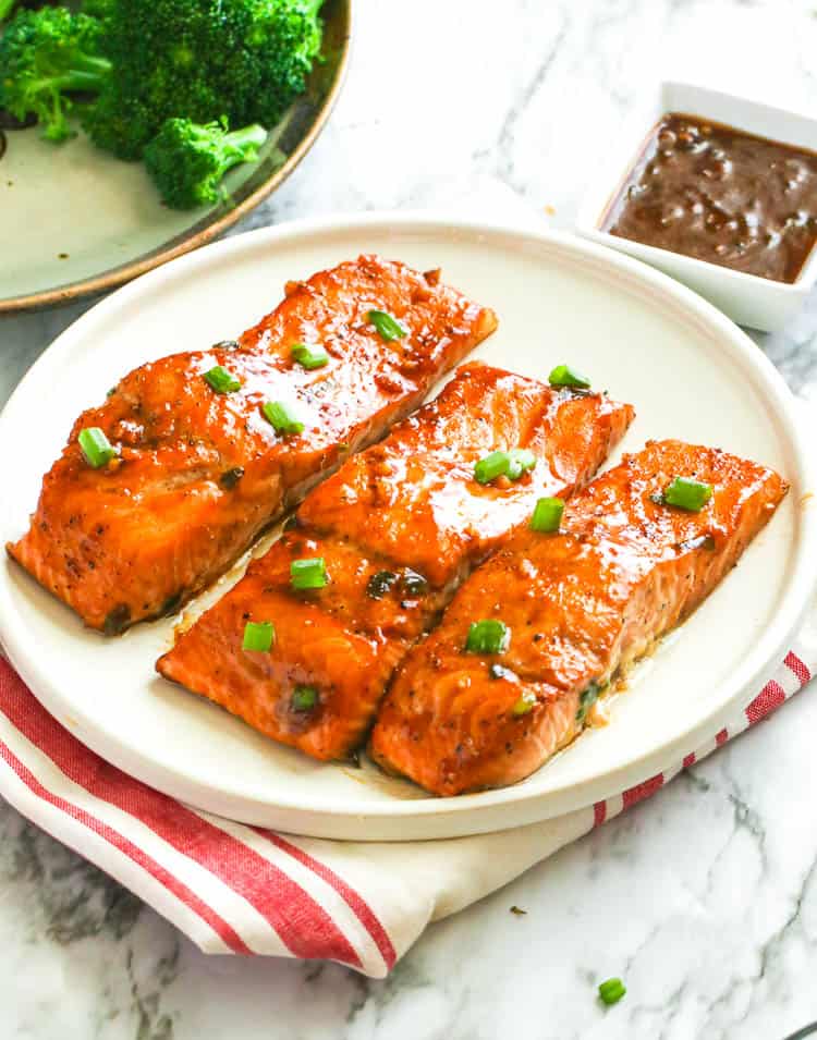 Umami, spicy, sweet Teriyaki Salmon on a white plate