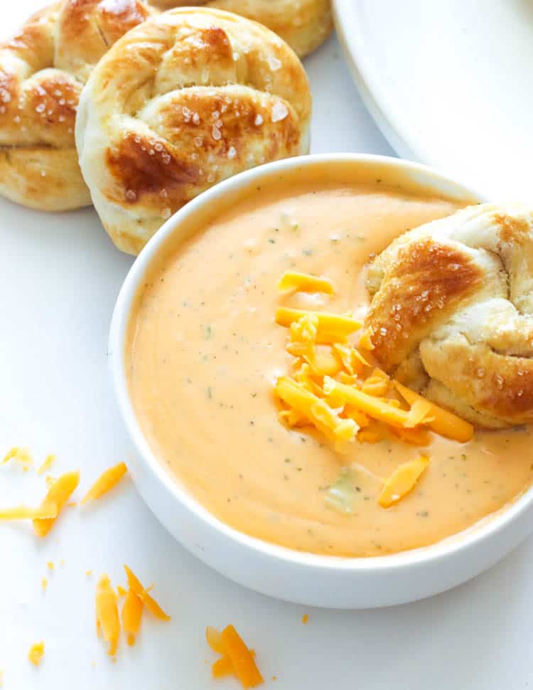 A Bowl of Beer Cheese Dip Served with Soft Pretzels