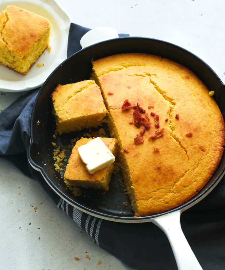 Sliced Southern Style Cornbread Topped with Butter and Bacon Bits