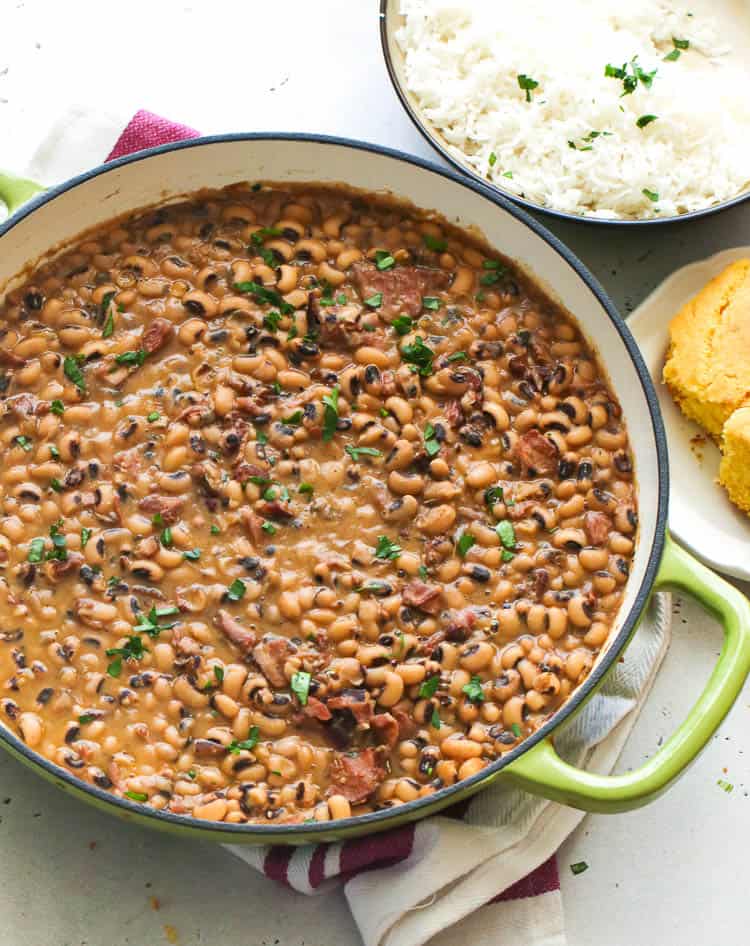 Black-eyed peas stew in a pot with rice on the side