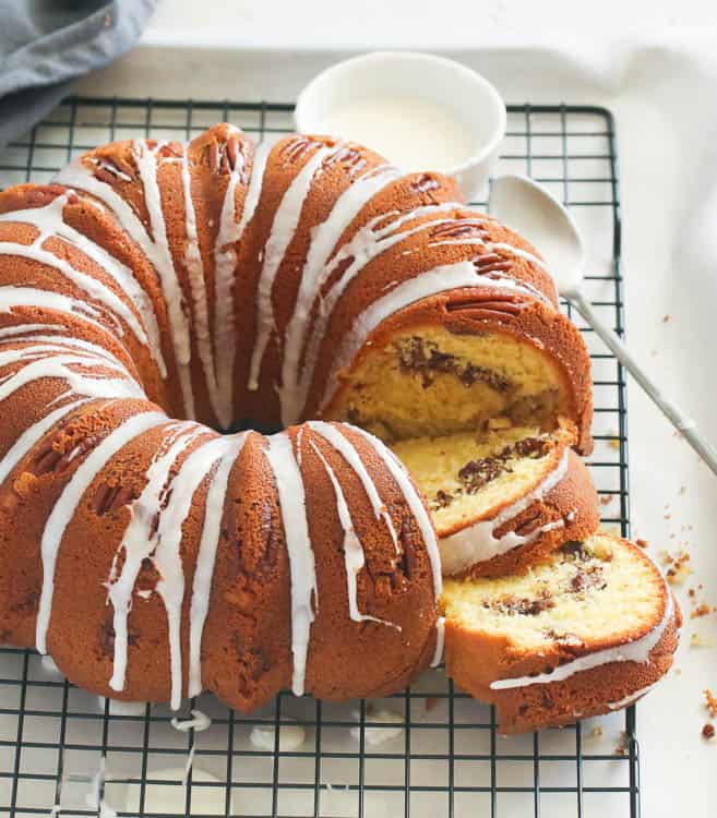 Sock it to Me Bundt Cake on a Cooling Rack Served with a Glaze on the Side