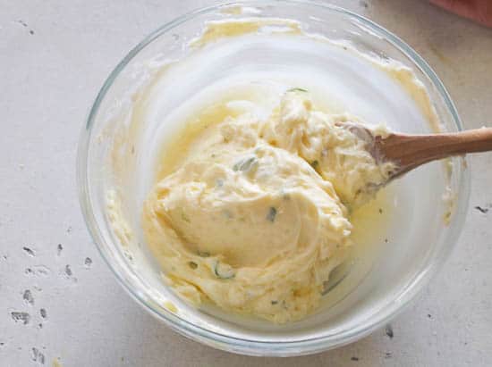 mixing the garlic butter in a clear bowl