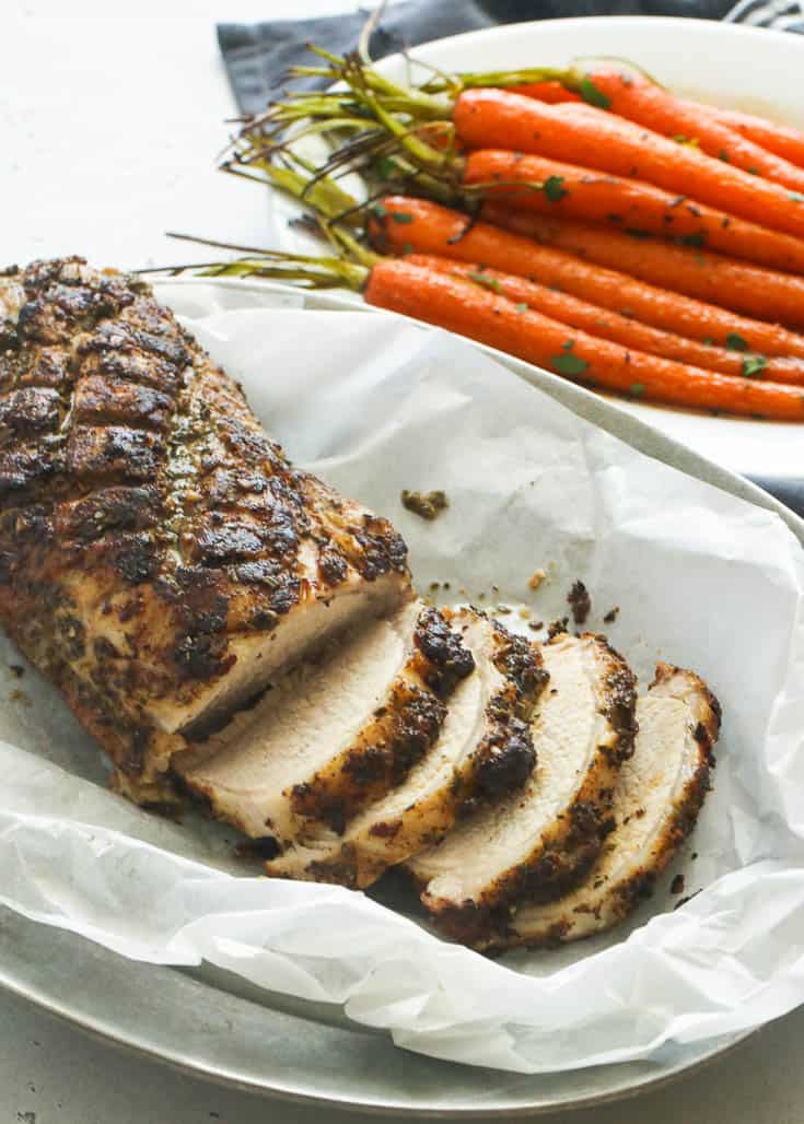 Herb Pork Loin Roast with carrots in the background