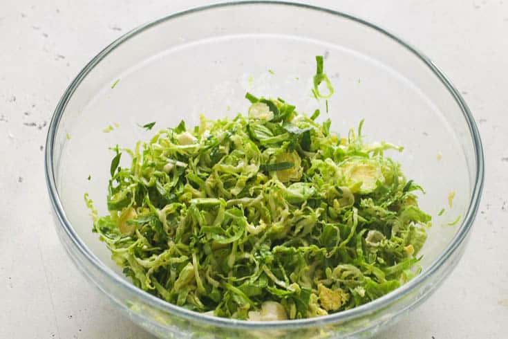 Shaved Brussel Sprouts in a Clear Bowl