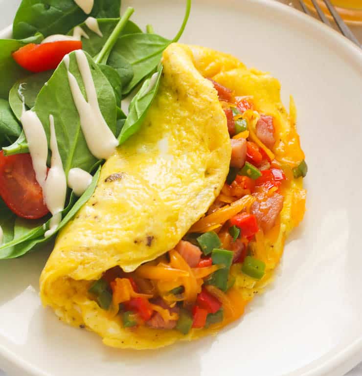 A Plate of Western Omelette Served with a Simple Salad