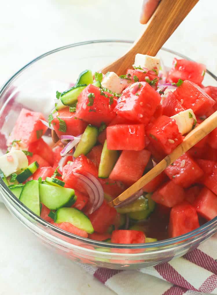Watermelon Salad tossed in a clear bowl