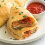 Homemade Calzone served on a white dish for fall snacks
