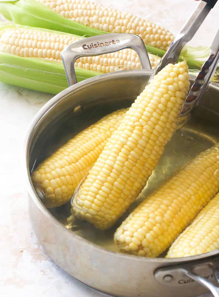 Remove the boiled corn from the pan