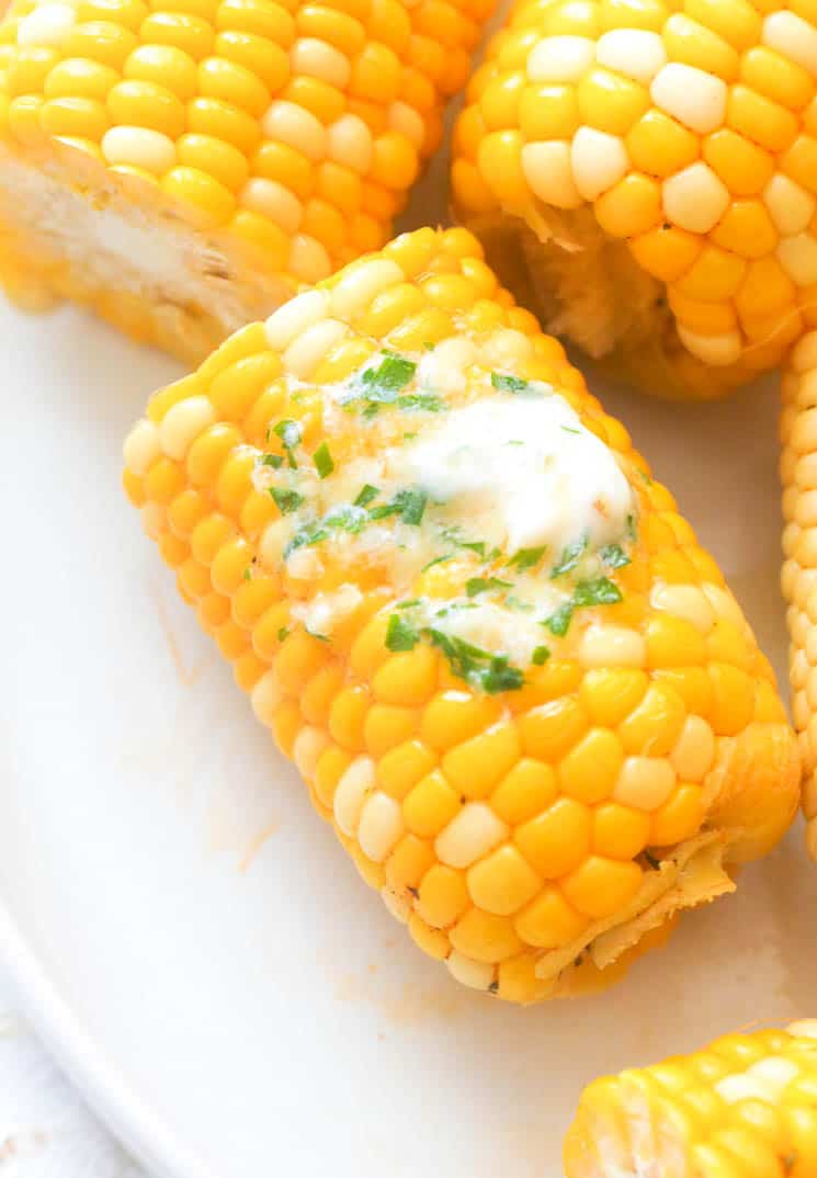 Boiled corn sprinkled with butter and coriander