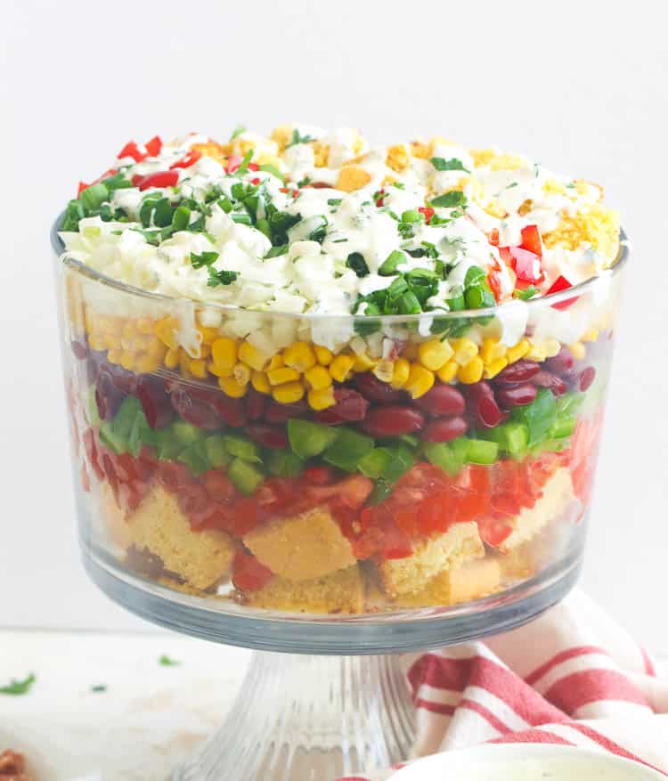 Beautiful layers of fresh produce, cornbread, and tomatoes