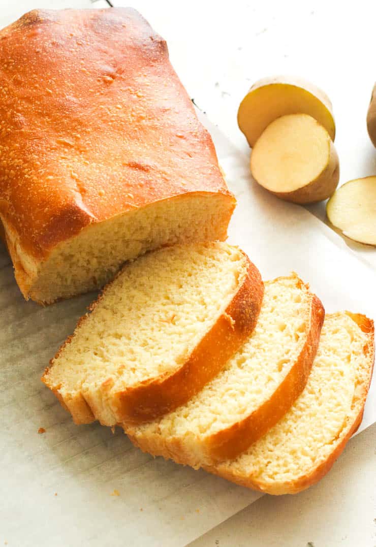 Sliced Potato Bread with Potatoes in the Background