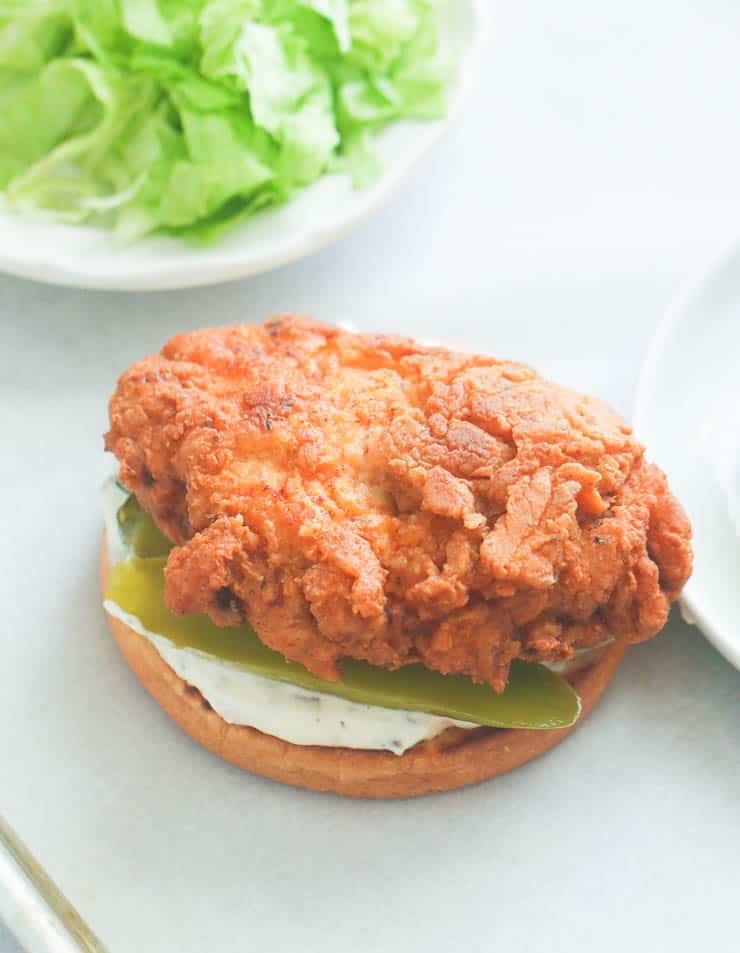 Assembling a drool-worthy chicken sandwich. 