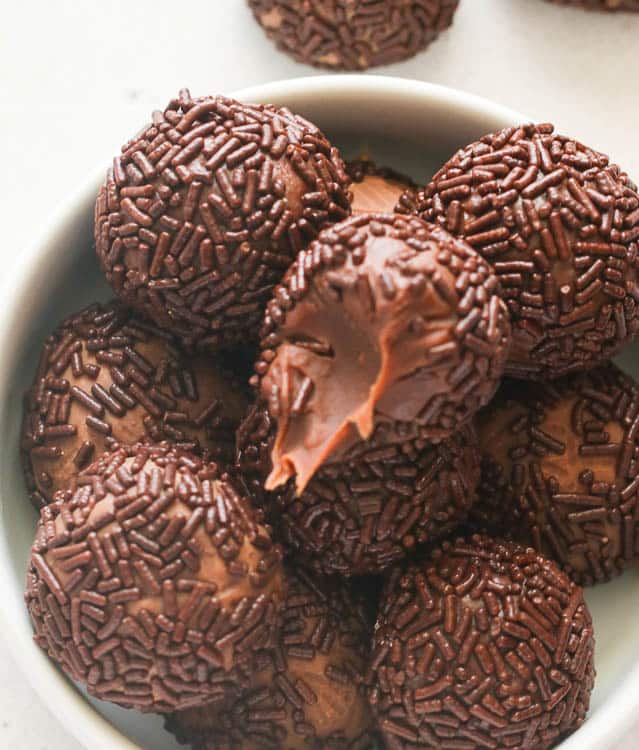 Biting into a decadent, chocolatey brigadeiro for the perfect Christmas dessert.  