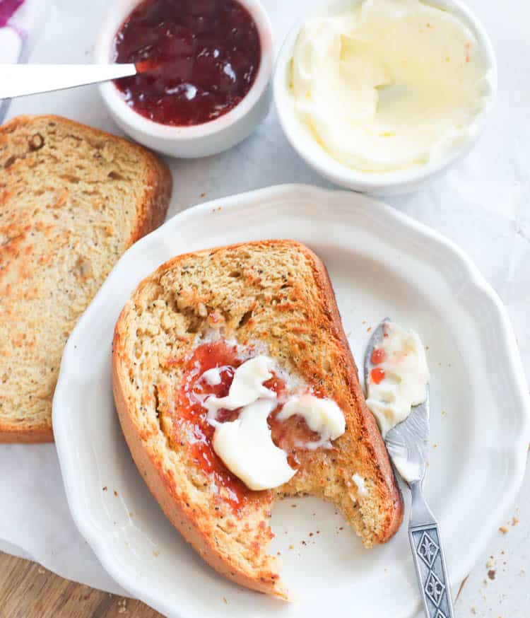 Sliced Whole Wheat Bread Smothered with Jam and Butter