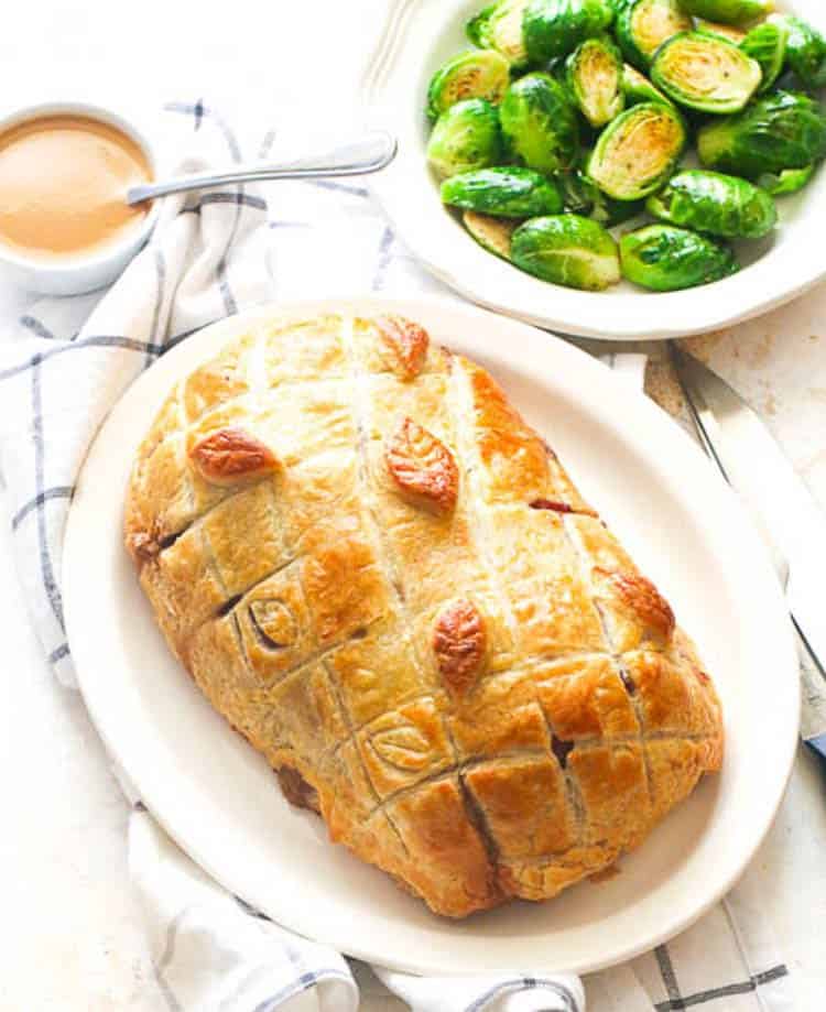 Beef Wellington fresh from the oven with sauteed Brussels sprouts