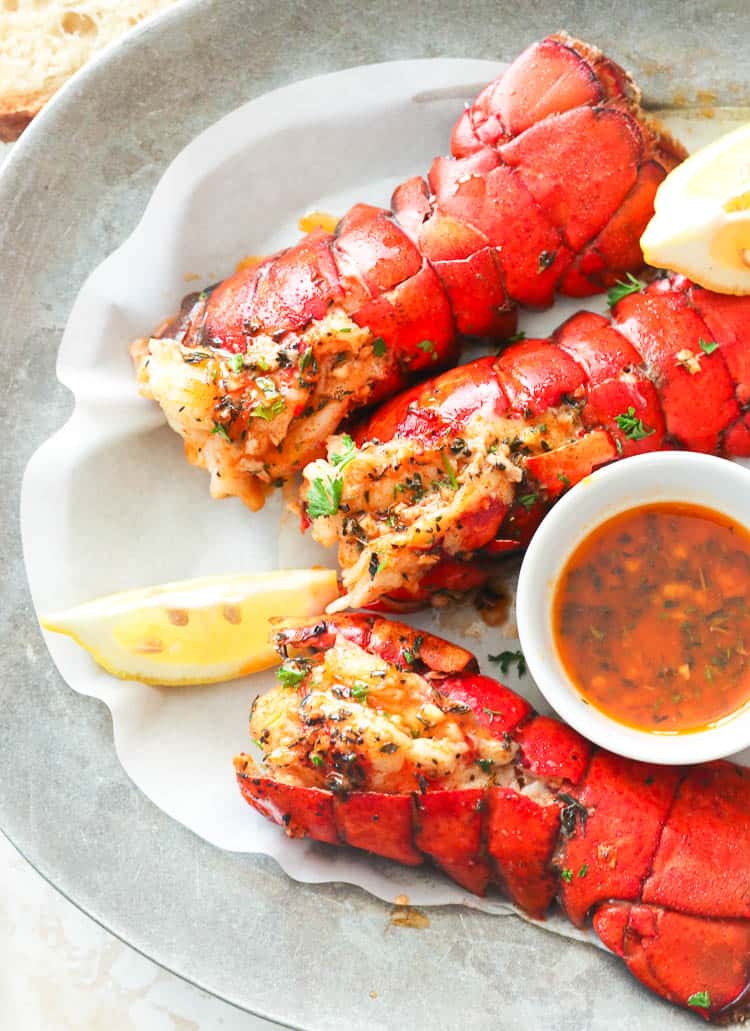 Broiled Lobster with decadent butter sauce and lemon wedges on the side