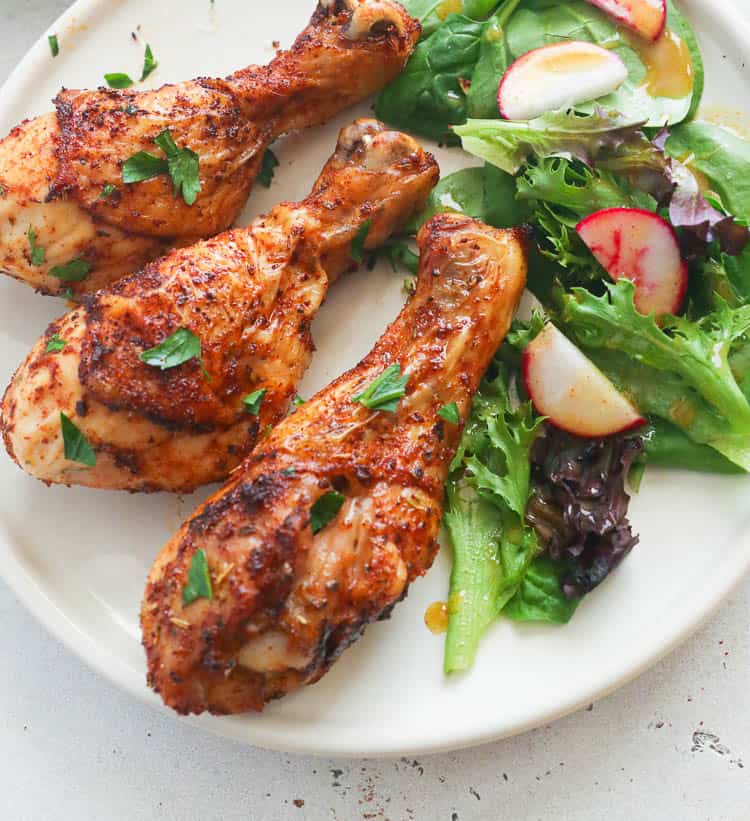 Air Fryer Chicken Legs with salad on the side