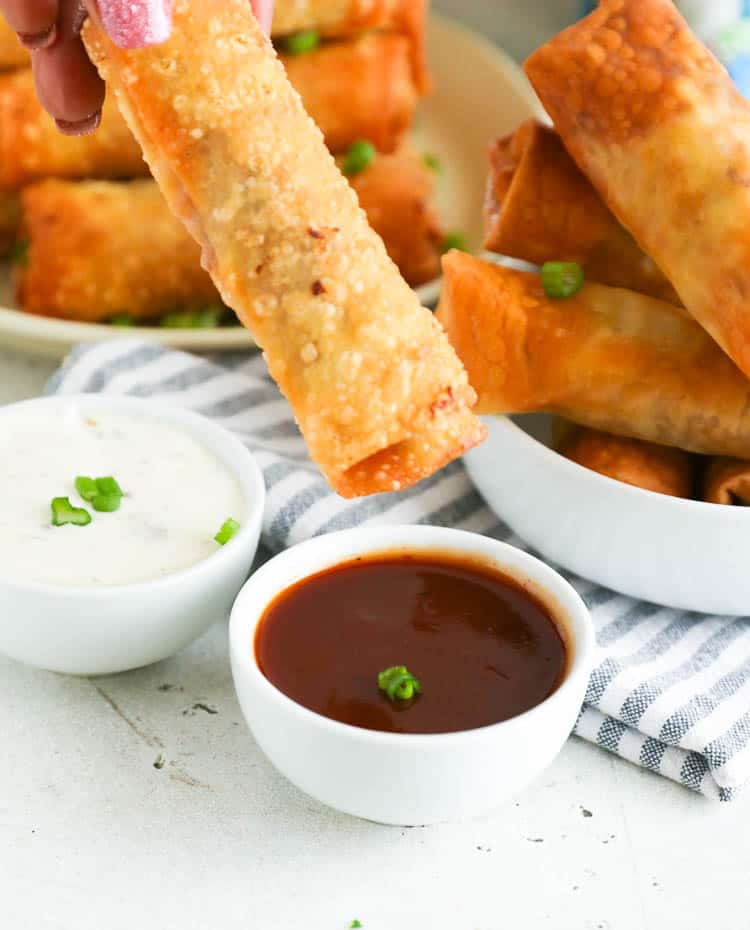 Pulled Pork Egg Roll Dipped in BBQ Sauce