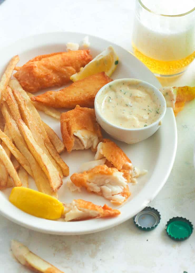 Flaky Fish and Crispy Chips in White Plate