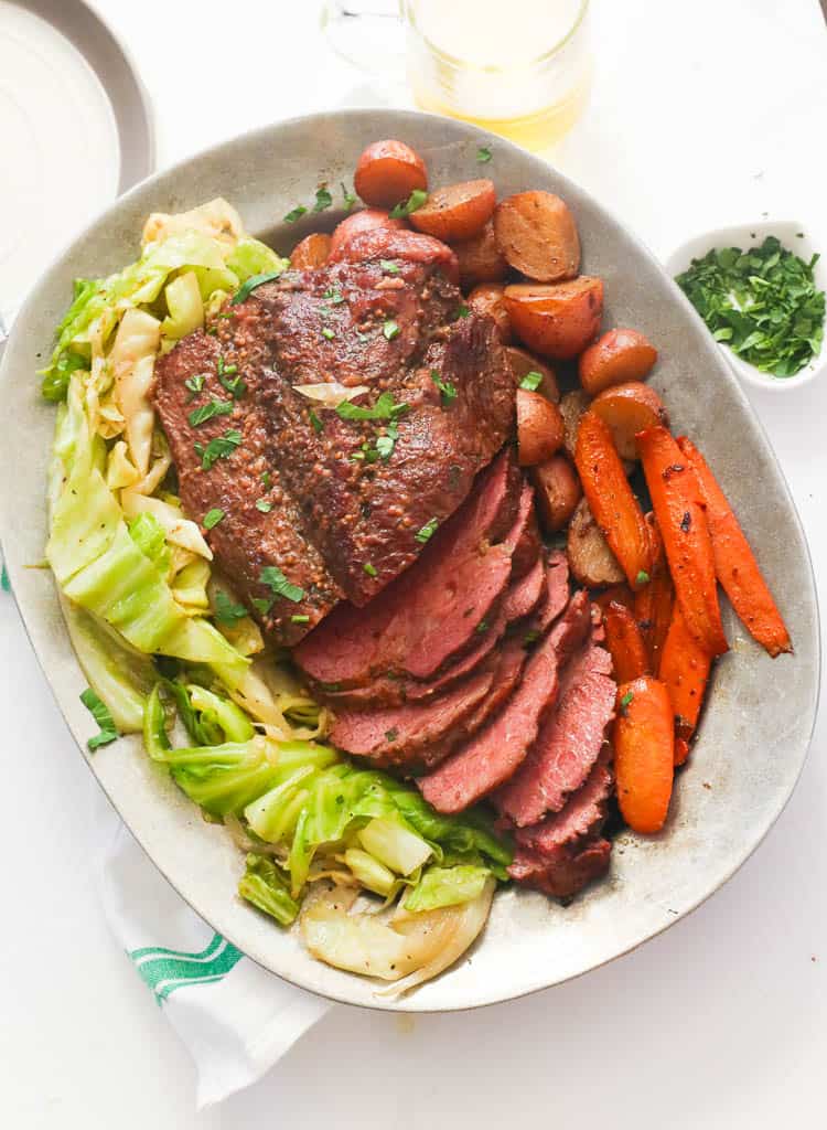 A Platter pf Sliced Corned Beef and Cabbage with Carrots and Potatoes